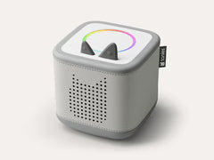 Moon grey Toniebox 2 audio player with perforated speaker, light ring and character-shaped controls