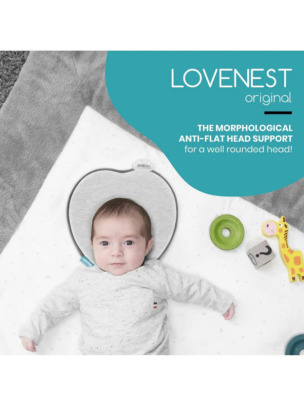 Gray baby head support cushion shown beneath an infant's head.