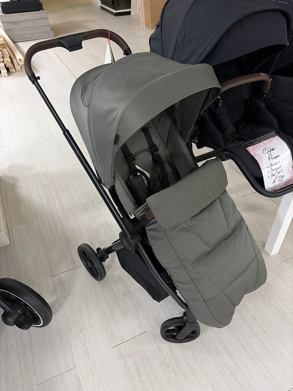 Sage green pushchair with extendable hood and padded footrest, side view