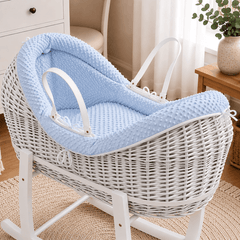 Blue wicker baby Moses basket with white stand and padded pod liner