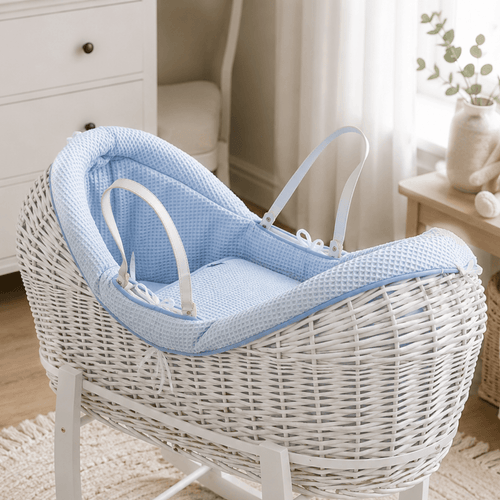 Light blue wicker baby Moses basket with white stand and padded pod liner