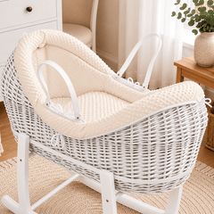 Cream wicker baby Moses basket with white stand and padded pod liner