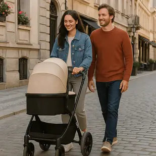 Man and woman walking with a stroller on a city street.