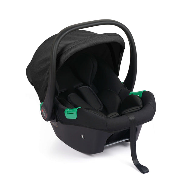 A black baby car seat with a matching black canopy and harness, featuring small bright green accent details on the side, shown on a clean white background.