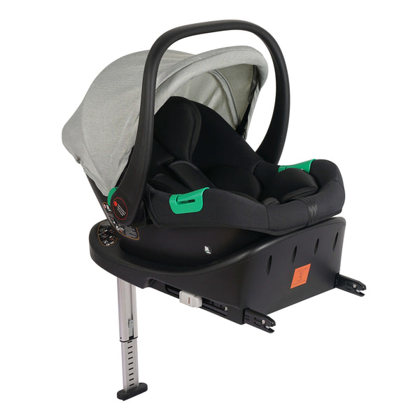 Sage infant car seat with grey canopy and black shell, side view with base