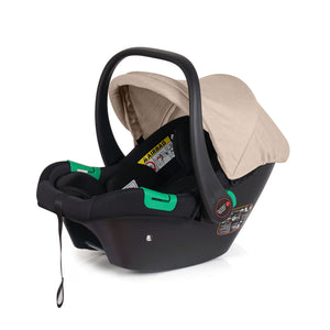 Dune beige and black infant car seat with handle, canopy, and base