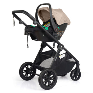 Travel system with black stroller frame and beige infant car seat