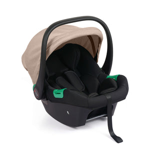 Black infant car seat with beige canopy and green carry handle