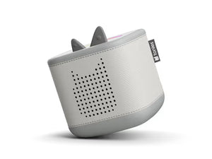 Moon grey Toniebox 2 audio player, tilted view of perforated speaker and raised controls