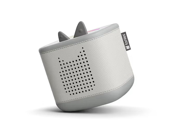 Moon grey Toniebox 2 audio player, tilted view of perforated speaker and raised controls
