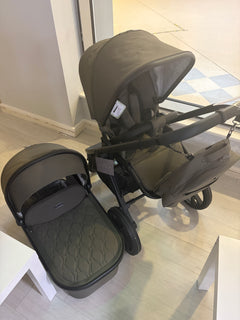 Moss pushchair with carrycot and hood, side view