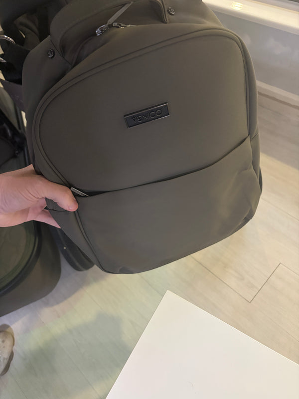 Moss carrycot with logo patch and curved panel seam, close-up