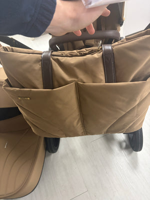 Caramel pushchair shopping basket with padded seat fabric and side pockets