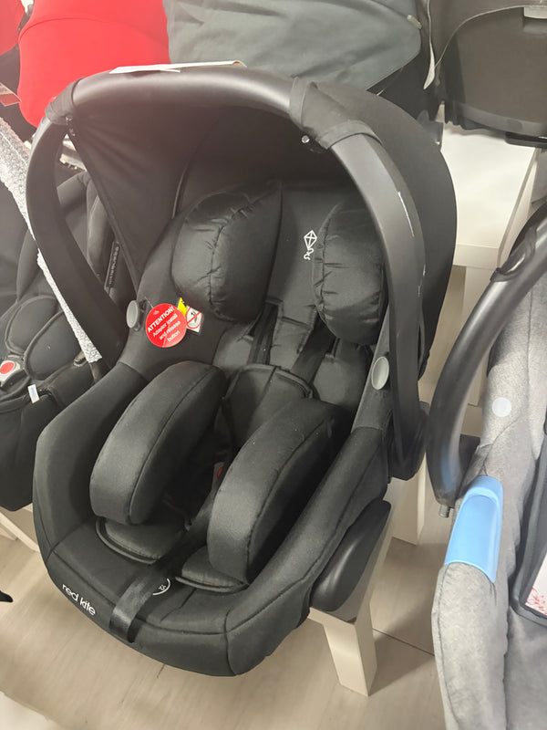 Red Kite newborn car seat, black padded headrest and harness straps, angled side view