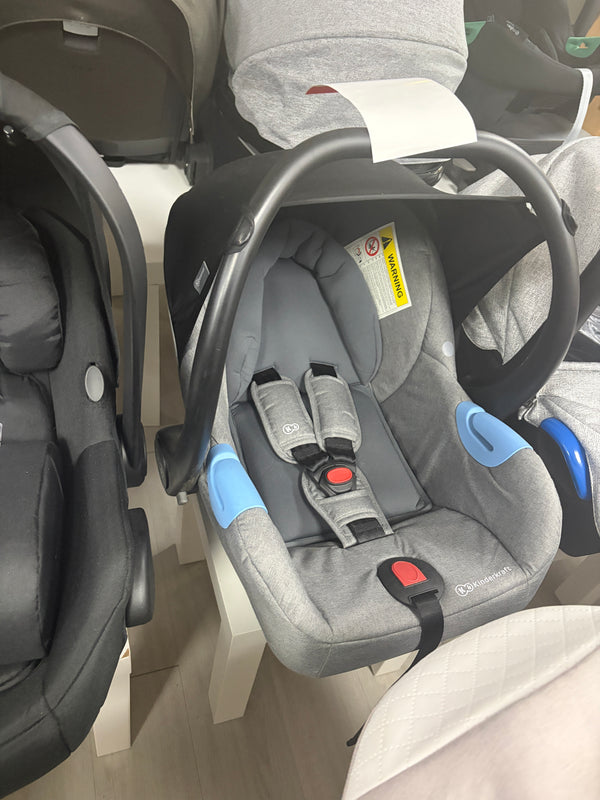 Grey newborn car seat with side shoulder pads, 5-point harness, padded headrest