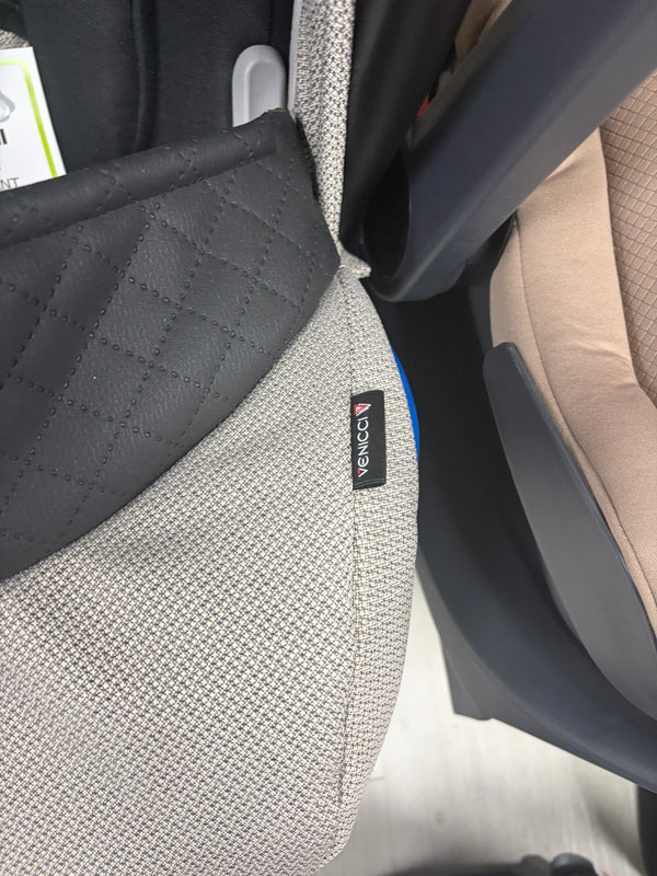 Newborn car seat insert with dark gray quilted panel and Venicci label