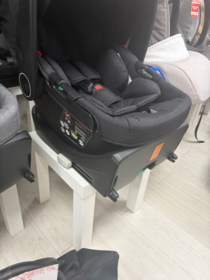 Black newborn car seat on ISOFIX base, side view with padded headrest