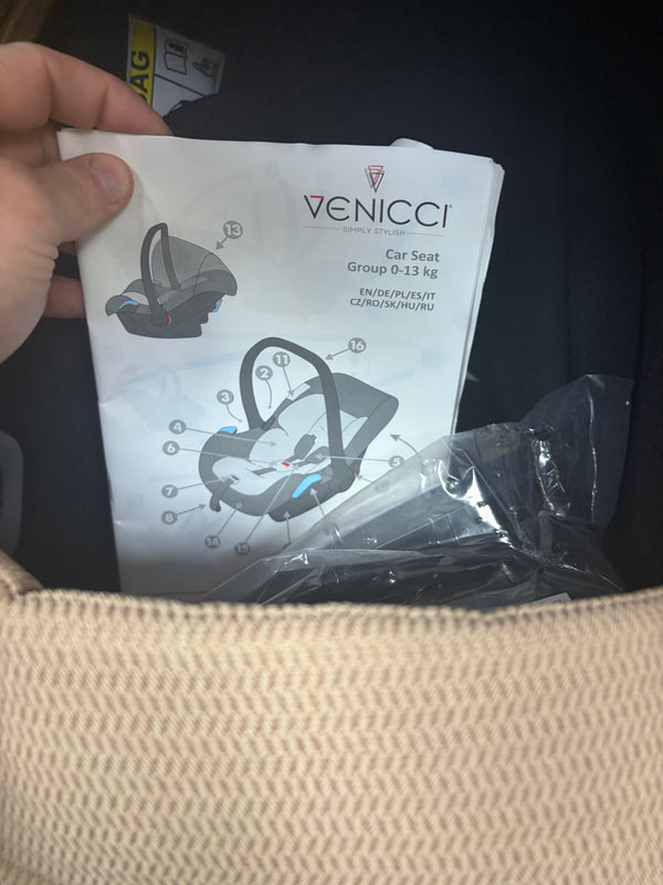 Venicci newborn car seat manual in protective plastic with diagram