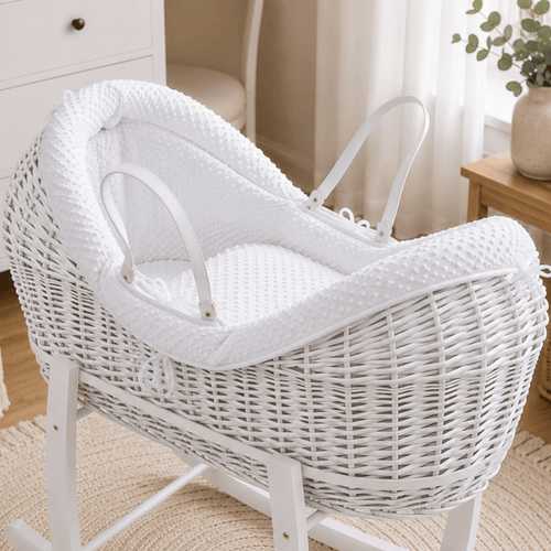White wicker baby Moses basket with white stand and textured padded pod liner