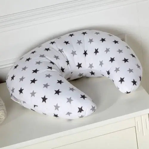 Breastfeeding pillow with star pattern on a white surface