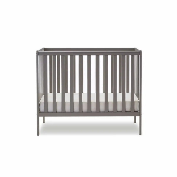 Taupe grey space-saver cot with end panel, vertical slats, and padded mattress